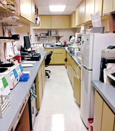 Photo of narrow room with laboratory equipment