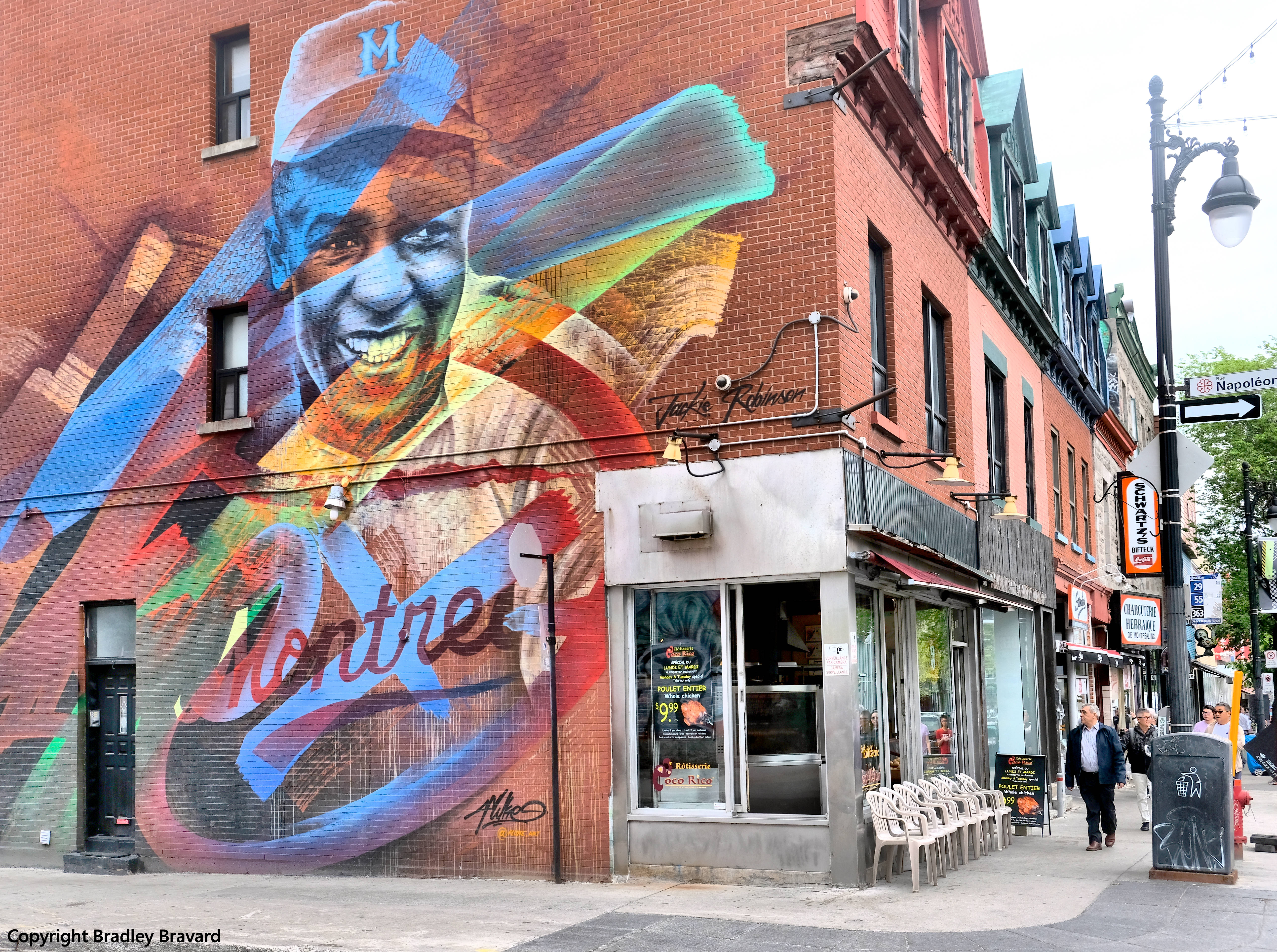 Jackie Robinson mural on brick wall of retail building in Montreal