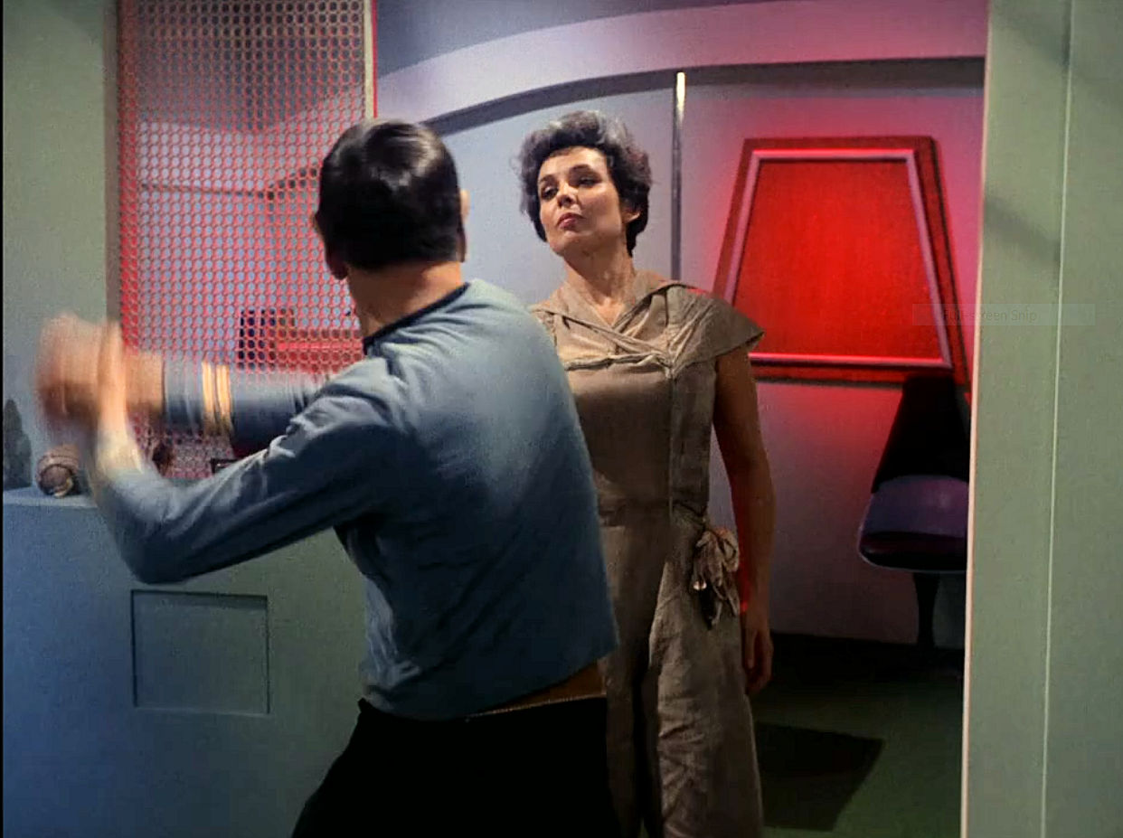 Image from Star Trek episode The Man Trap showing Spock striking salt vampire in form of Nancy Crater