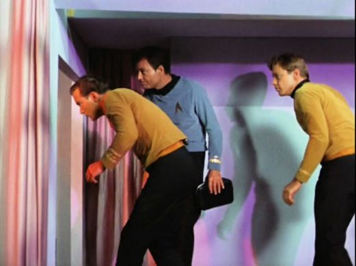 Image from Star Trek episode The Corbomite Maneuver showing, left to right, Kirk, McCoy, and Bailey on Balok's ship