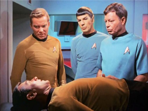 Image from Star Trek episode Balance of Terror showing Kirk, Spock, McCoy standing and Stiles on sickbay bed