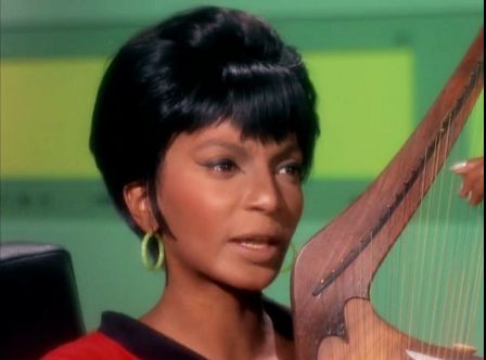 Image from Star Trek episode The Conscience of the King showing Uhuru singing and playing a lyre